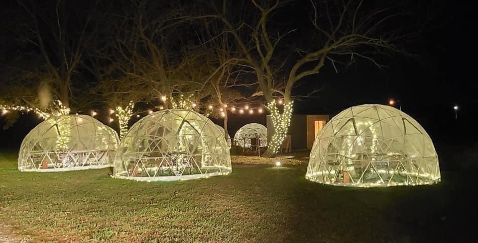 Outdoor dining bubbles with string lights