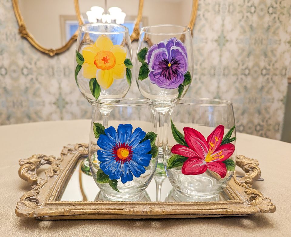 Flowers painted on wine glasses from Windmill Creek Vineyard and Winery